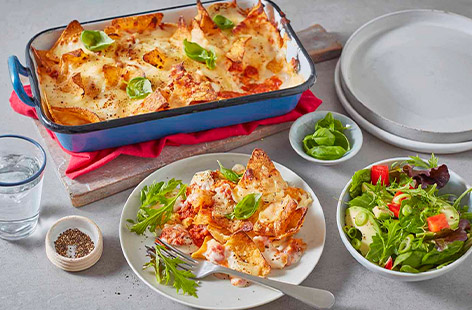 The whole family will love this fun take on an Italian classic. Use up leftover bolognese in this hearty baked nachos dish, the tortilla chips provide a satisfying crunch!