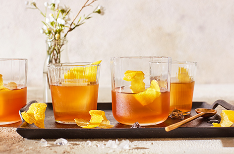 If you enjoy a classic cocktail on the rocks, you'll love this Cuban-inspired twist on an old fashioned. Instead of bourbon and sugar, enjoy spiced dark rum and honey, muddled over ice and garnished with bitters and lemon peel.