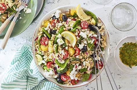 This colourful pasta salad recipe is packed full of veggies and herbs, and finished with creamy salad cheese. It makes a fab barbecue side dish!