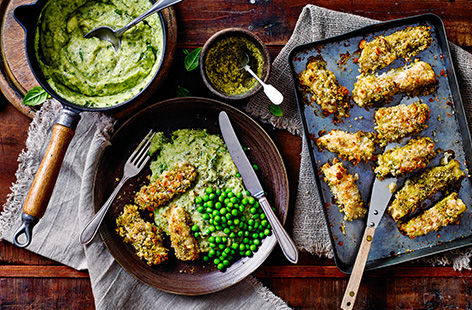 Have a go at making a family favourite from scratch with this easy pesto fish fingers recipe. A layer of pesto under crispy breadcrumbs gives the fish fingers maximum flavour - serve with peas and vibrant broccoli mash for an easy way to get some extra veg.