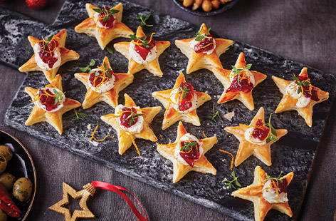 These festive-looking stars are made from a sheet of puff pastry and topped with cranberry sauce, soft cheese and a sprinkle of fresh thyme leaves and orange zest. They're the perfect party canapé!