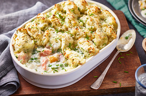 In this fish pie, the creaminess is turned up a notch with the addition of garlic and herb soft cheese. The soft cheese adds a silkiness to the sauce, as well as a lovely herby flavour. Topped with chive mash, this dish sure to become a new favourite.