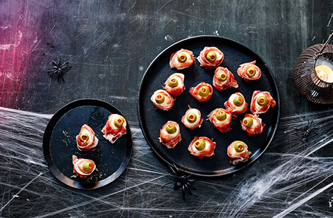 Made with mozzarella balls, prosciutto, and olives these clever little 'eyeballs' are a great Halloween party snack