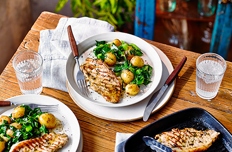 Pack pork with flavour with this herby marinated pork loin recipe, served with potatoes and fresh greens for a hearty dinner idea ready in 30 minutes. Pork steaks are marinated in lemon, garlic and fresh coriander then griddled for a simple summer meal.