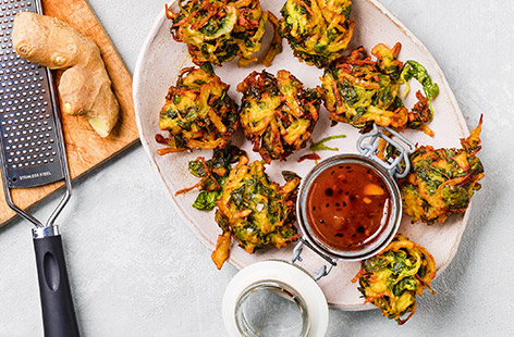 Crispy, spicy and moreish, pakoras are the ultimate Indian snack or tasty side to enjoy with your favourite curry. This classic potato and spinach recipe from food author, Nik Sharma happens to be vegan, healthy and ready in 30. Give them a go!