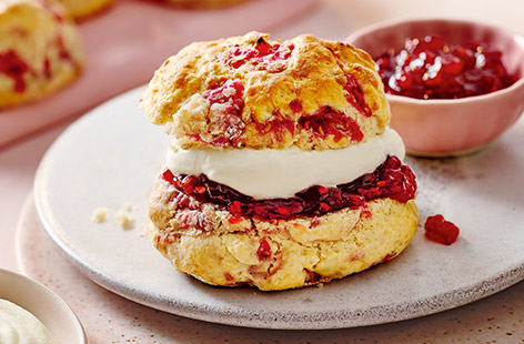 Make Mother's Day extra-special this year. These raspberry scones are made with pink lemonade for a fabulously fluffy texture. Serve with jam and a generous dollop of cream for a sweet treat mum will love. 