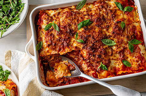Fancy a lasagne without all the faff? This cheat's version uses Bolognese ravioli and chunky veg pasta sauce for all the flavours of a lasagne in half the time. It's perfect for staycations or when you don't want to spend ages cooking. 