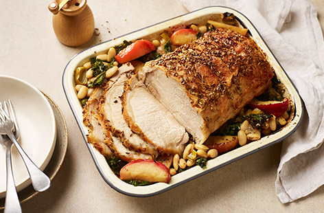 Take your roast pork to new heights with a seasoning of fennel seeds and black pepper. Sit the pork loin onto a bed of apples, leeks and beans, and cover in a creamy mustard sauce for a rich roast that makes great leftovers the next day.
