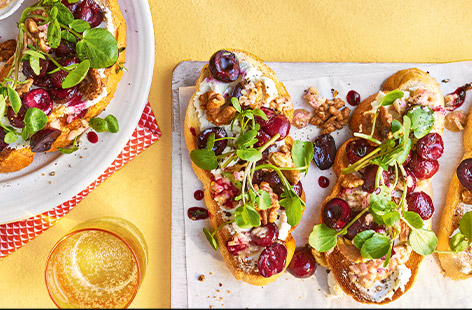 Top golden toast with sweet roasted cherries, goat's cheese and toasted walnuts for an easy but special summer lunch.