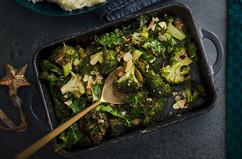 Florets of crisp broccoli and caramelised curly kale are topped with flaked almonds in this simple recipe