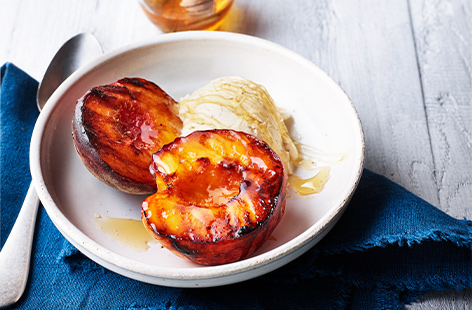 There's nothing that hits the spot quite like a quick and easy dessert, and these honey-glazed peaches are just that