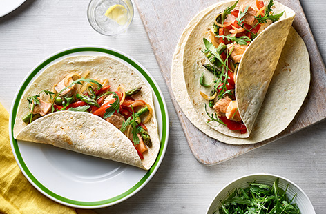 Try this springtime twist on a classic - salmon is gently spiced with cumin and cayenne pepper and wrapped up with peppers and asparagus for a lighter touch on the family favourite.