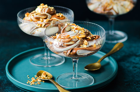 Nutty and toasty in flavour, creamy tahini works beautifully with rich dark chocolate. These sharing mousses are decadence in a bowl: Tahini-vanilla cream is stirred into a dark chocolate cream then topped with toasted nuts and seeds. Watch everyone dig in!