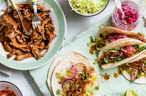 For the ultimate foodie feast, this slow-cooker pulled pork recipe is fantastic. Made with spicy Mexican chipotle chilli and a hint of orange, the meat is cooked until falling off the bone, then served with tortillas and macerated onions