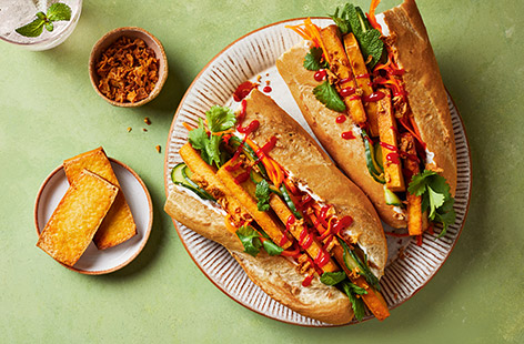 Our take on the classic Vietnamese sandwich is this quick and easy recipe, served with a zingy carrot and cucumber pickle and slices of smoked tofu coated in sweet, salty and spicy flavours. This makes a fun and fresh fakeaway for two or a great treat lunch.