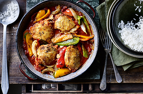 Try this Spanish-inspired chicken and peppers one-pot recipe for a hassle-free winter warmer. Peppers, onion and tender chicken thighs are simmered in a spiced tomato sauce and served with fluffy rice for a hearty dinner.