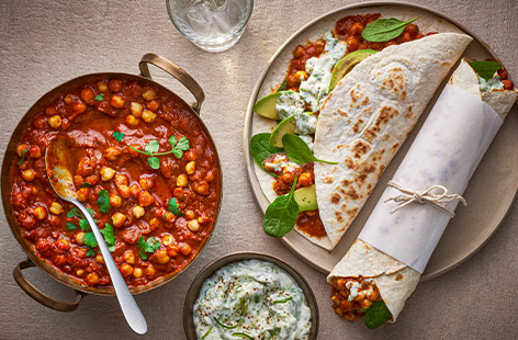 Transform leftover chana masala into flavourful lunchtime wraps. Stuffed with spiced chickpeas and a cool vegan raita, these wraps are sure to liven up your lunch routine.