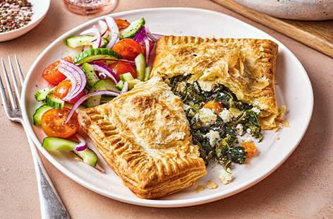 Spinach and feta are stuffed into golden puff pastry turnovers for a midweek meal the whole family will love. This savoury bake is made using frozen veg, to help you cut down on your food waste. 