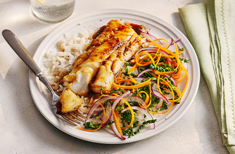 Use whatever fish you fancy in this recipe. Make a sticky marinade with soy sauce and ginger, then serve with fluffy rice and colourful veg. 