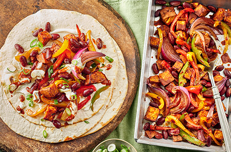 Let the family dig in to these tasty sweet potato fajitas that are full of flavour and easy to rustle up midweek. Simply roast the veggies in the oven then pile into tortilla wraps with crème fraîche or soured cream. 