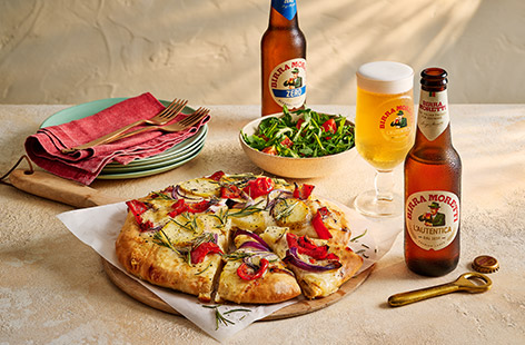 An easy homemade pizza base topped with bold Med flavours sounds like perfect night-in food to us! Sliced potatoes, red onion, tangy Gruyère and creamy mozzarella provide a great mix of flavours and textures, with chargrilled pepper and aromatic rosemary for a final flourish!