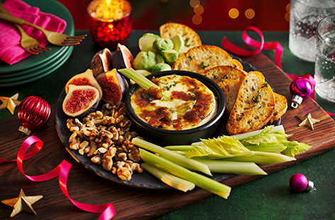 Take baked brie to the next level with a golden brûlée top using brown sugar. Serve this cheesy platter up at your next Christmas party with crunchy crudités.