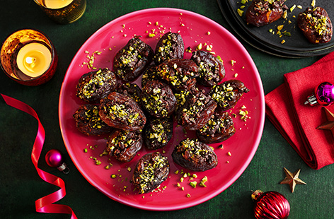Melt chocolate, nuts and dried cranberries and stuff into juicy dates for an elegant, sweet canapé.