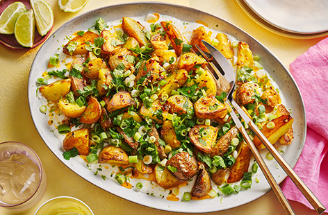 These crispy chilli potatoes make the perfect summer side dish. Served with creamy coconut yogurt, a drizzle of chilli oil and plenty of coriander, try these spuds as a barbecue side dish for big summer flavours.