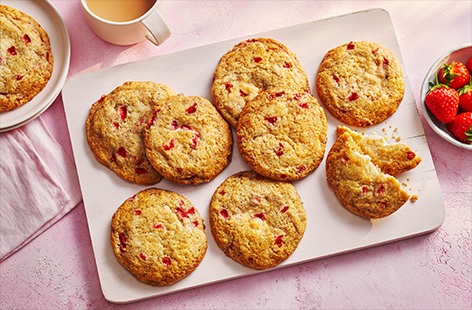 These cookies are filled with a hidden cheesecake centre for an epic summer sweet treat. Fresh strawberries are folded through the cookie dough to make a gloriously fruity bake.