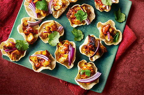 These mini chicken poppadoms couldn't be easier. Simply marinate your chicken in spices, then cook until charred and crispy. Pop the chicken into mini poppadoms and serve for your Diwali celebrations.