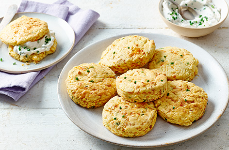 A dairy-free, gluten-free alternative to classic scones so you don't have to miss out on one of life's best teatime treats. Punchy Cheddar gives these scones an irresistible flavour, topped off with dairy-free cream cheese spread and sprinkled with fresh chives.