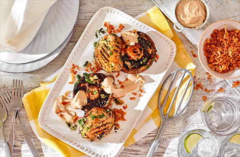 Whip up garlicky Portobello mushrooms, drizzled in Tesco Fire Pit truffle flavour mayonnaise and scattered with crispy onions for your next barbecue feast.