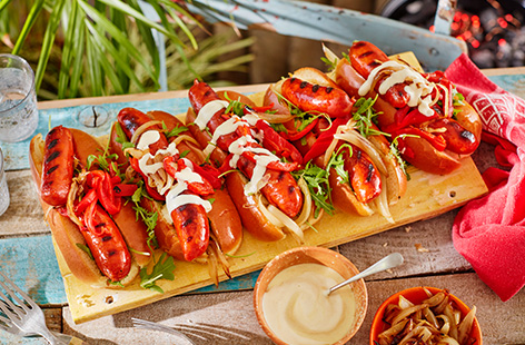 Forget boring bangers, hot dogs get a spicy makeover with Fire Pit chorizo sausages, sweet onions, roasted red peppers and a quick homemade aioli.