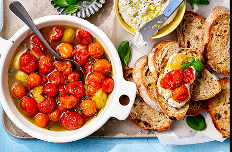If you're lunching alfresco, you can't beat a tasty bruschetta and this recipe is extra-special with slow-roasted cherry tomatoes and a zesty, herby ricotta spread. Serve as an appetizer, starter or side if you're hosting, or save the cooled, roasted tomatoes for midweek lunches and snacks.