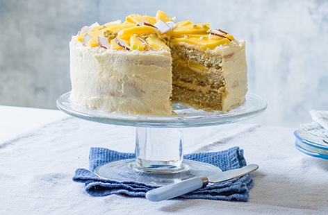 Bursting with tropical flavour from coconut, passion fruit and mango, this gorgeous vegan birthday cake recipe is so delicious.