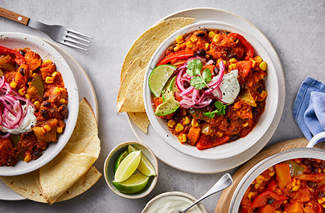 Warming and nutritious, this vegetarian chilli is made with black beans, sweet potato and our batch-cook tomato sauce