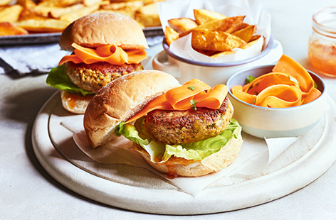 Spiced chickpeas make an excellent veggie burger and this recipe with crispy potato wedges and lots of fresh and zingy trimmings happens to be healthy and vegan too! A top treat for any night of the week – why not try for meat-free Monday?