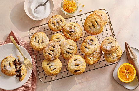 Eccles cakes are little pastry pies filled with currants, mixed peel and spices. Delicious with a cup of tea!