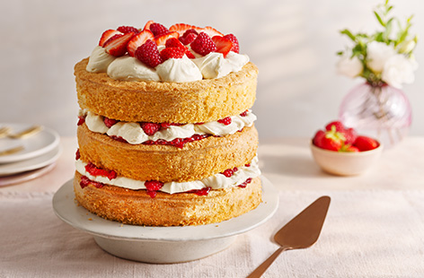 This beautiful summer cake makes a great afternoon tea treat or post-barbecue dessert. It's made up of three fatless sponges sandwiched together with an elderflower-spiked cream and fresh strawberries and raspberries - delicious! 