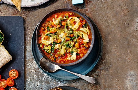 This quick and easy kids' soup recipe packs in lots of vegetables and comes topped with shop-bought tortelloni and pesto.
