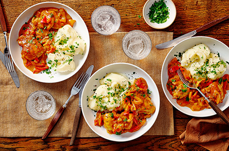 Chicken paprikash is a classic Hungarian recipe made with onions and peppers in a creamy paprika sauce.
