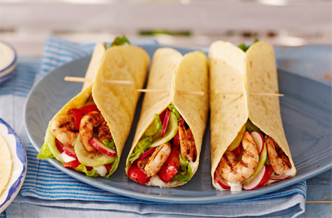 These Mexican-inspired smoky prawn and pepper wraps are packed full of punchy flavour, try serving them with a dollop of cooling guacamole. If you're using wooden skewers, soak them in cold water for 20 minutes to stop them from catching on the barbecue