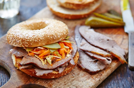 Sesame seed bagels filled with lightly dressed coleslaw, gherkins, mustard and finely sliced beef fillet – a delicious deli-style lunch.