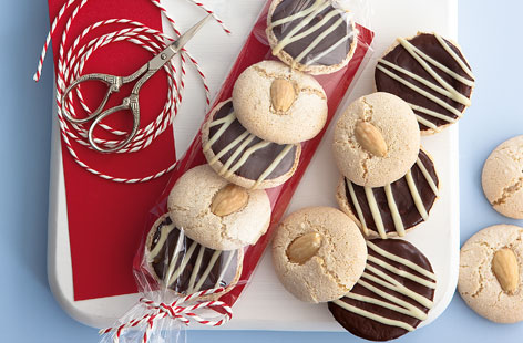 These festive home-bake macaroons make for a delicious edible gift or even just a warming winter tuck-in. Packed with rich almond flavour and a mixed blend of chocolate icing, friends and family are sure to love them.