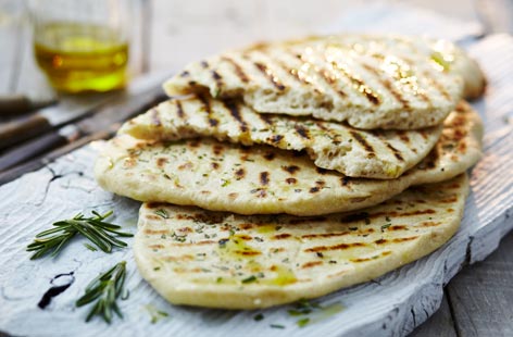 If you've never made bread before, flatbreads are a great place to start. Ready in less than an hour and with a delicious rosemary topping, these are perfect for dips, curries and meat skewers. For that charred look, cook them on a barbecue or hot griddle pan.