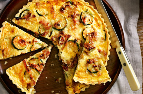 Bacon and courgette make for a lovely pairing in this summery tart, which is a great dish for weekend lunches or picnics. The rest of the filling is made with egg, single cream and Gruyère cheese. You can make it ahead and freeze it, if you prefer.