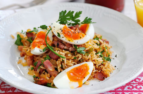 Upgrade your Saturday morning bacon and eggs with this quick and easy recipe. This dish calls for microwave long grain rice, cutting out a lot of prep time. Cayenne pepper adds a lovely kick. Scatter fresh parsley over before serving.