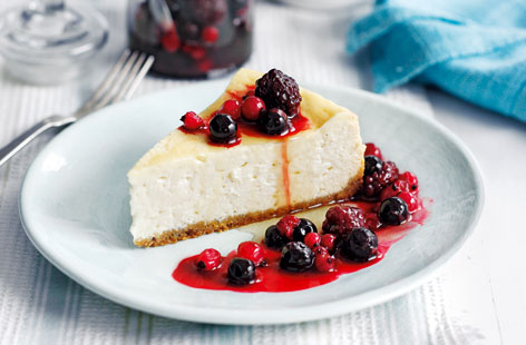 A fruity twist on the classic vanilla baked cheesecake, made with maple syrup, crunchy digestives and topped with a juicy berry compote