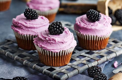 Use blackberries for a seasonal twist on the classic red velvet cake. These indulgent blackberry and chocolate cupcakes are smothered in a glossy cream cheese frosting and topped with dark, plump, shiny jewels