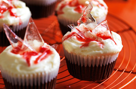This cupcake gets a spooky halloween makeover made with 'blood' of raspberries